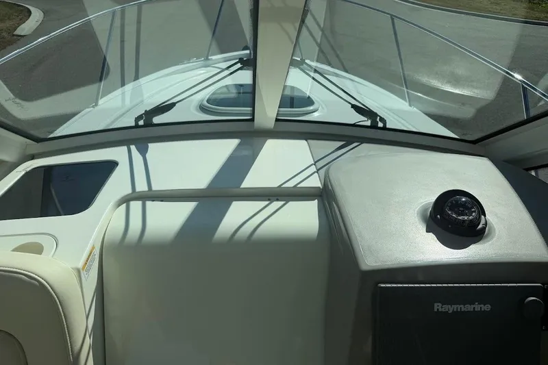  Yacht Photos Pics 2017 Boston Whaler 285 Conquest helm with compass and Raymarine equipment.