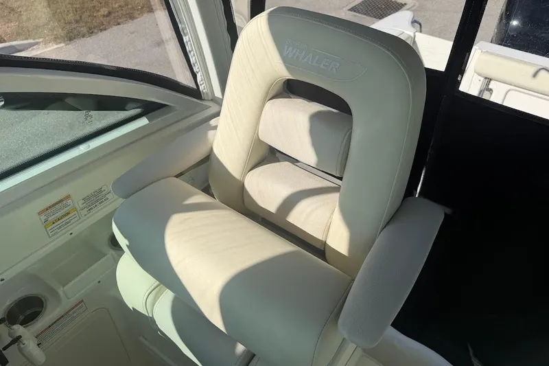  Yacht Photos Pics 2017 Boston Whaler 285 Conquest boat seat, white upholstery, interior view.