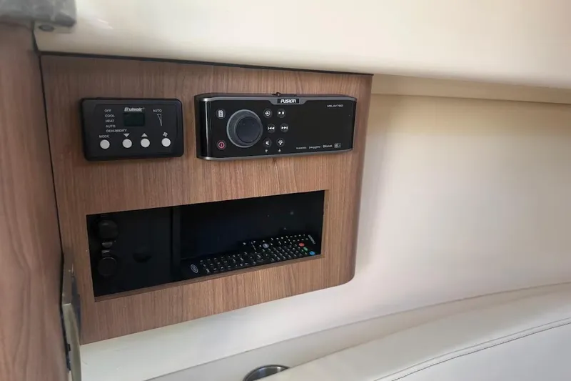  Yacht Photos Pics Control panel on 2017 Boston Whaler 285 Conquest boat, featuring audio and climate controls.