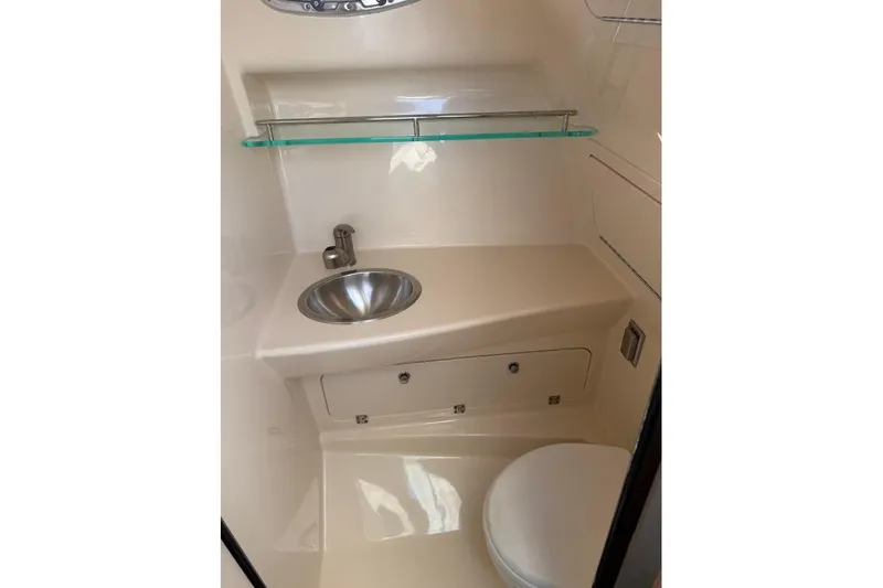  Yacht Photos Pics 2017 Boston Whaler 285 Conquest bathroom with sink, toilet, and storage.