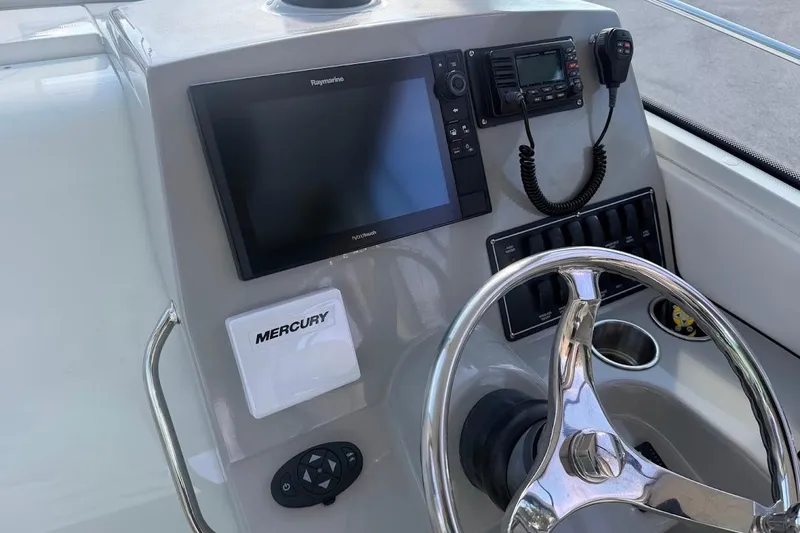  Yacht Photos Pics Helm of 2017 Boston Whaler 285 Conquest with Raymarine electronics and Mercury controls.