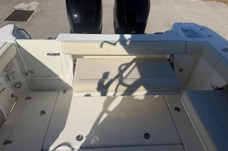  Yacht Photos Pics 2017 Boston Whaler 285 Conquest boat interior with seating and dual engines.