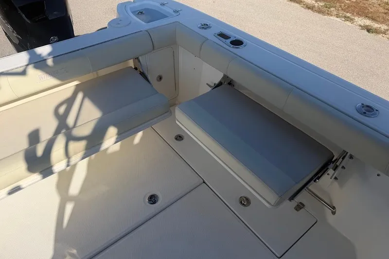  Yacht Photos Pics 2017 Boston Whaler 285 Conquest boat interior with foldable seating and storage.