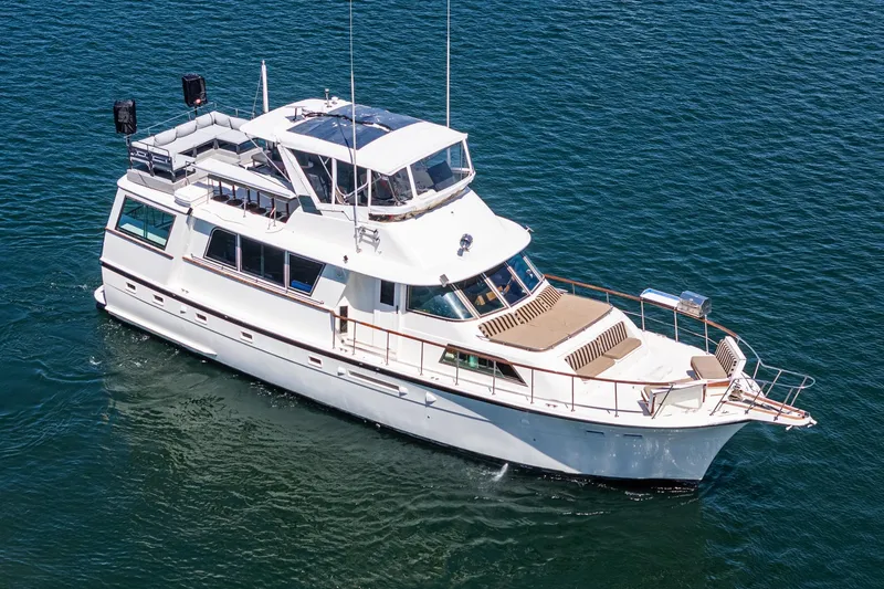 Maverick Yacht Photos Pics 1979 Hatteras 58 Motor Yacht cruising on open water, aerial view.