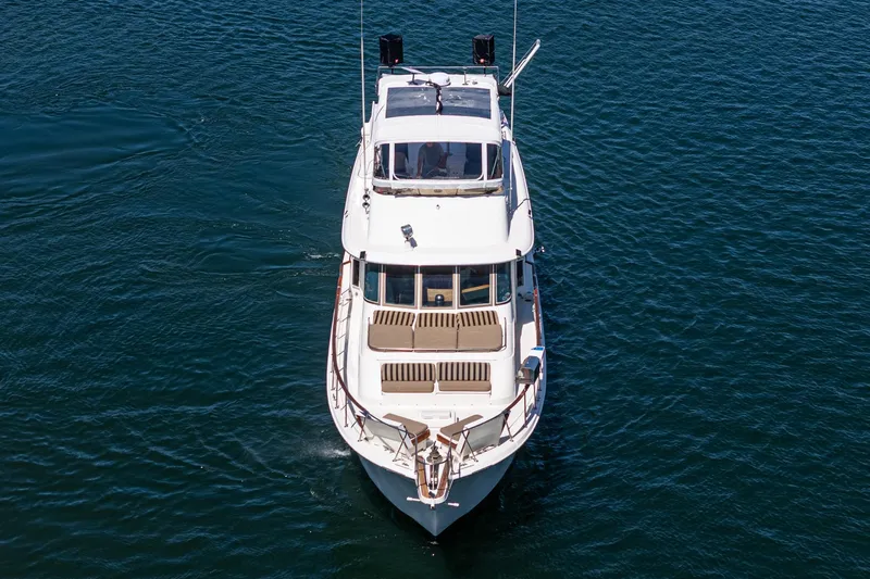Maverick Yacht Photos Pics 1979 Hatteras 58 Motor Yacht cruising on open water, aerial view.