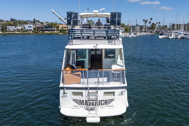 Maverick Yacht Photos Pics 1979 Hatteras 58 Motor Yacht cruising in San Diego harbor, sunny day, clear skies.