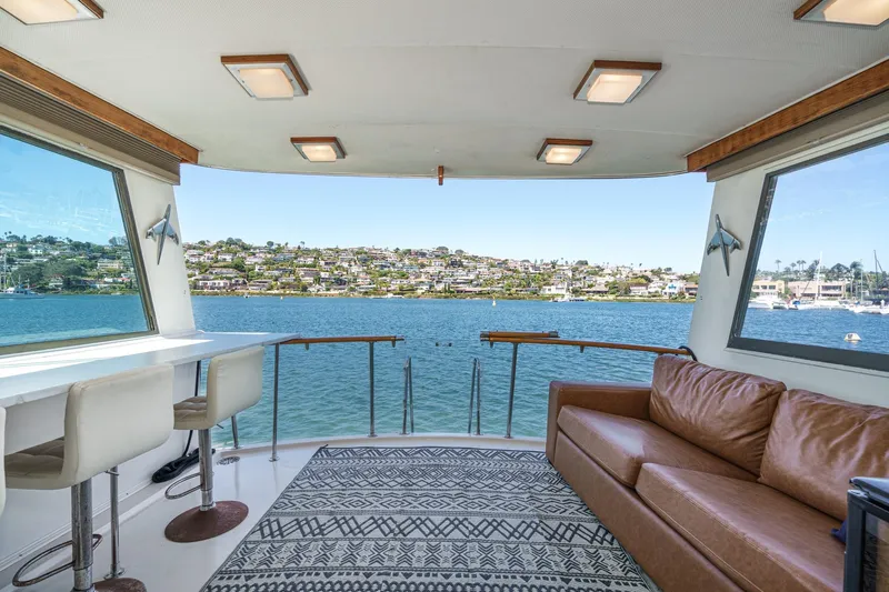 Maverick Yacht Photos Pics Interior of 1979 Hatteras 58 Motor Yacht with scenic waterfront view.