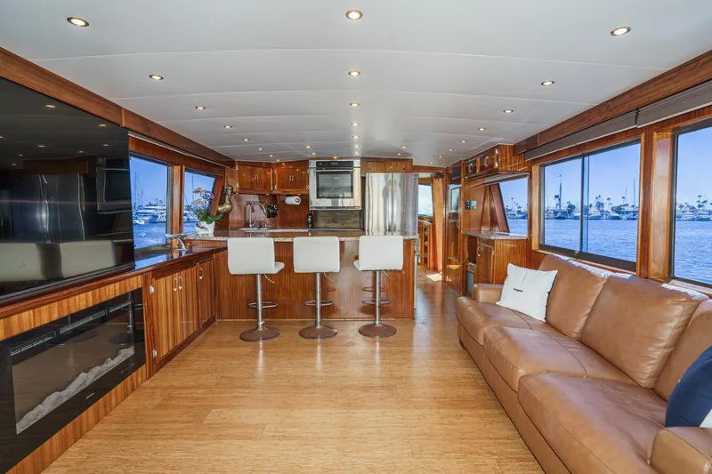Maverick Yacht Photos Pics Luxurious interior of 1979 Hatteras 58 Motor Yacht with modern kitchen and seating area.