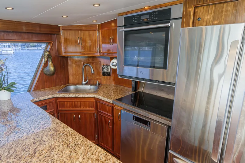 Maverick Yacht Photos Pics Luxurious kitchen interior of 1979 Hatteras 58 Motor Yacht with modern appliances.