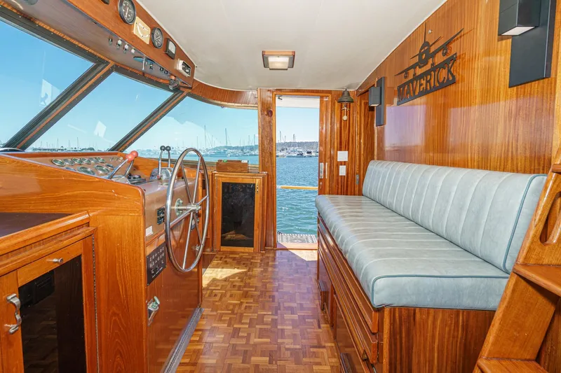 Maverick Yacht Photos Pics Interior of 1979 Hatteras 58 Motor Yacht with wooden helm and seating.