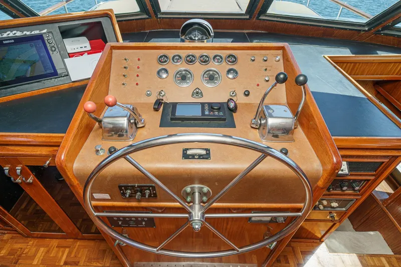 Maverick Yacht Photos Pics 1979 Hatteras 58 Motor Yacht helm with classic wooden dashboard and navigation instruments.