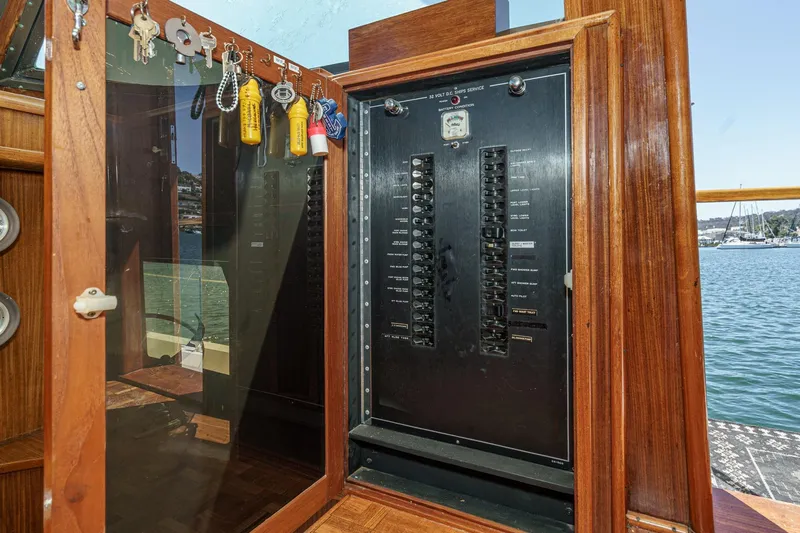Maverick Yacht Photos Pics Electrical panel on a 1979 Hatteras 58 Motor Yacht with key storage.