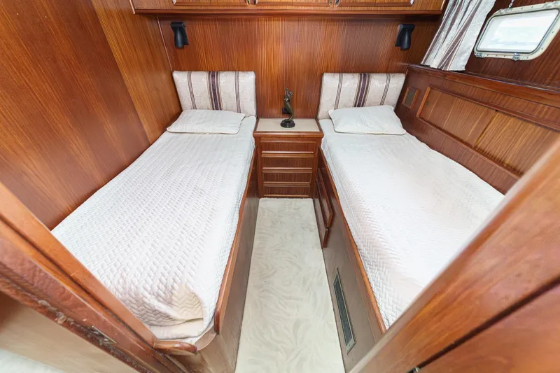 Maverick Yacht Photos Pics Twin cabin with wood paneling in 1979 Hatteras 58 Motor Yacht.
