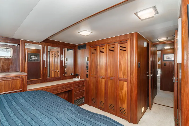 Maverick Yacht Photos Pics Interior of 1979 Hatteras 58 Motor Yacht with wood paneling and cozy bedroom.