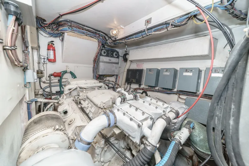Maverick Yacht Photos Pics Engine room of 1979 Hatteras 58 Motor Yacht with visible wiring and equipment.