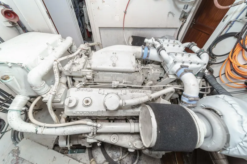 Maverick Yacht Photos Pics Engine room of a 1979 Hatteras 58 Motor Yacht, showcasing detailed machinery.