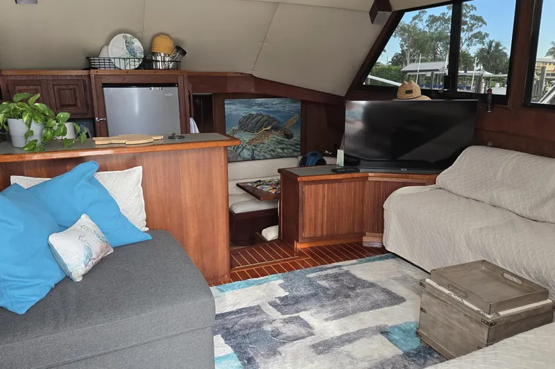 Wild Life Yacht Photos Pics Cozy interior of 1989 Viking 45 Convertible yacht with modern decor and seating area.