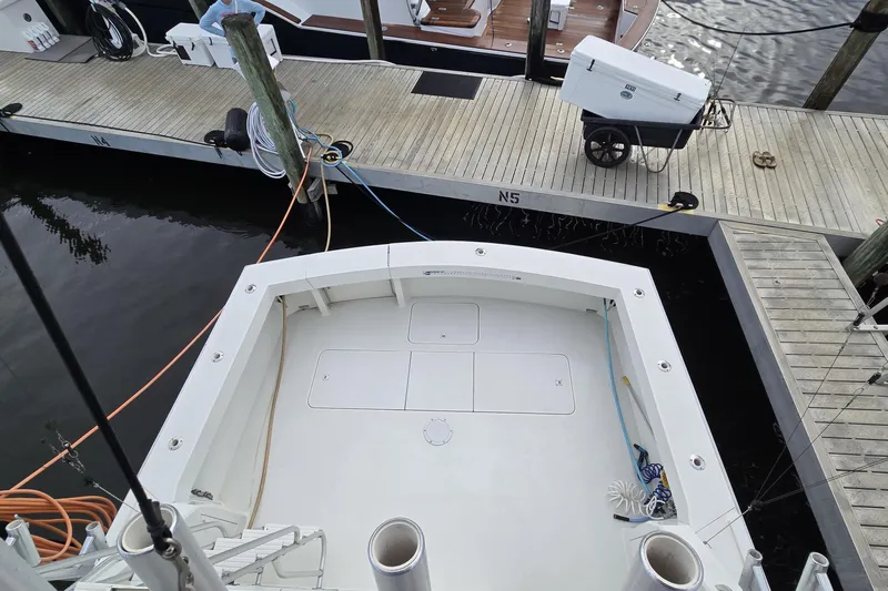 Wild Life Yacht Photos Pics 1989 Viking 45 Convertible boat docked at marina, view of spacious deck area.