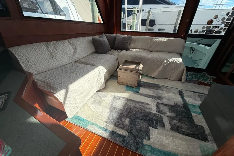 Wild Life Yacht Photos Pics Luxurious interior of 1989 Viking 45 Convertible yacht with cozy seating and modern decor.