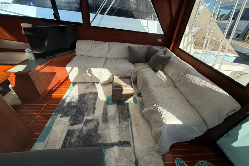 Wild Life Yacht Photos Pics Interior of 1989 Viking 45 Convertible yacht with cozy seating and modern decor.