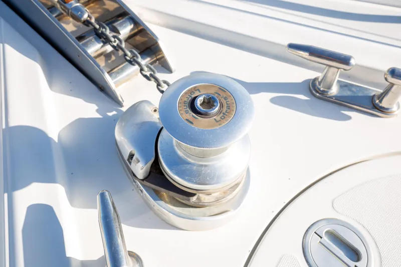  Yacht Photos Pics Anchor winch on 2002 Pershing 52 yacht deck, featuring polished metal components.