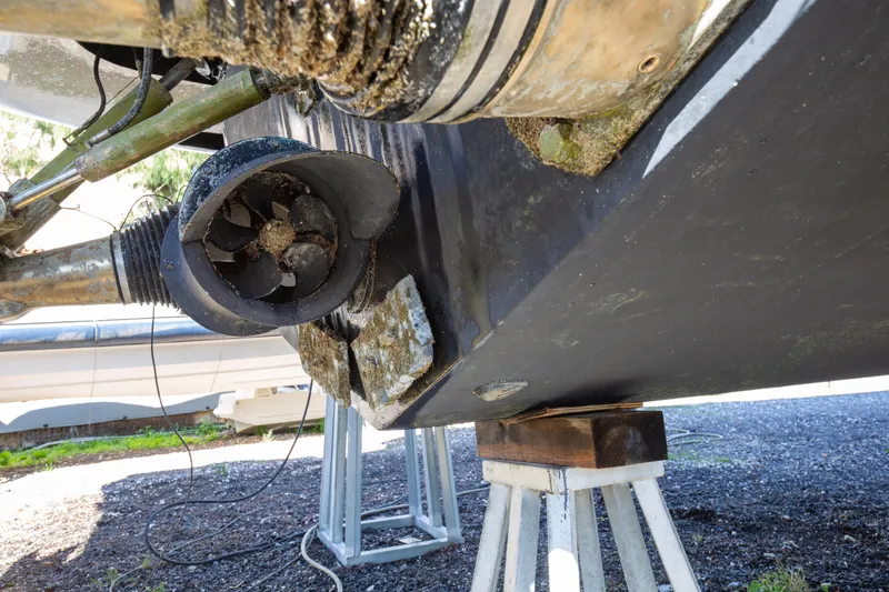  Yacht Photos Pics Close-up of 2002 Pershing 52 yacht's propeller and hull on a stand.