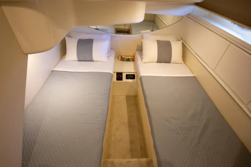  Yacht Photos Pics Twin cabin interior of 2002 Pershing 52 yacht with modern bedding.