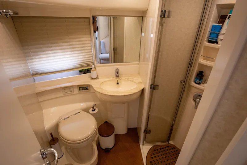  Yacht Photos Pics Luxurious bathroom in a 2002 Pershing 52 yacht with modern amenities and elegant design.