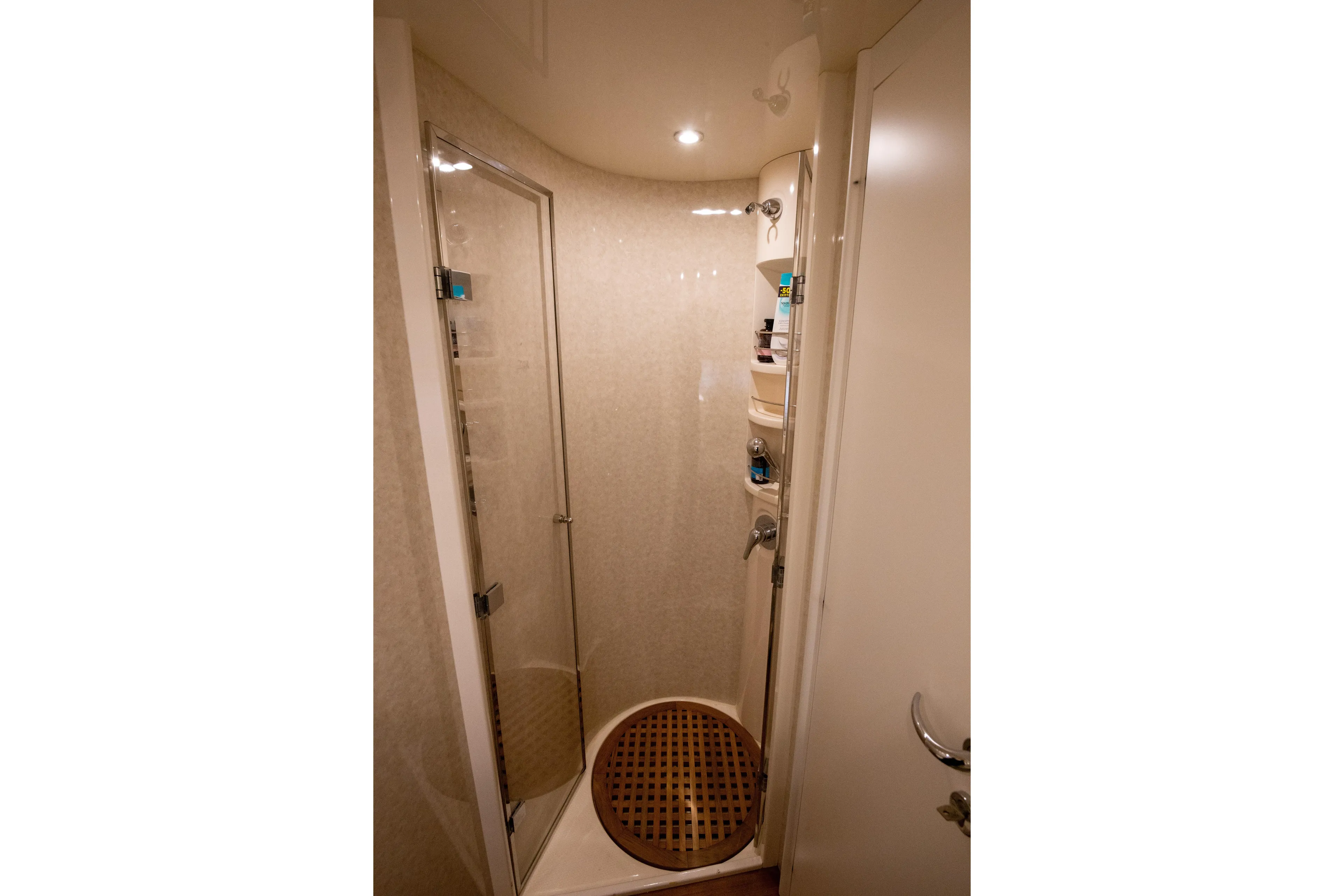  Yacht Photos Pics Shower area in 2002 Pershing 52 yacht with glass door and wooden floor.