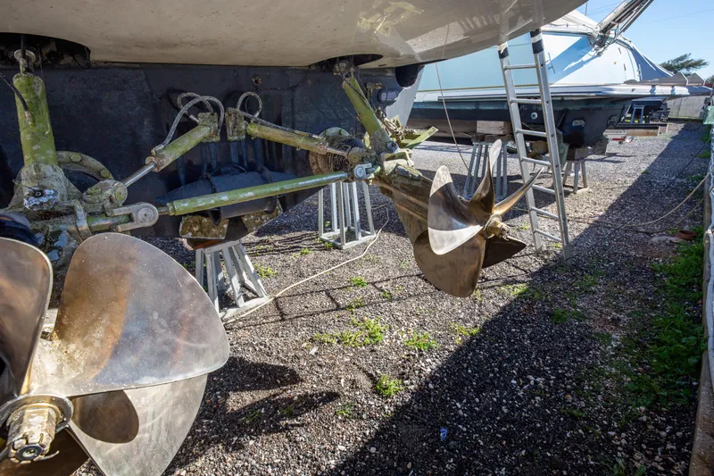  Yacht Photos Pics Propellers of a 2002 Pershing 52 yacht on dry dock, showing maintenance details.