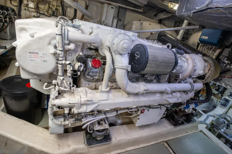  Yacht Photos Pics Engine room of a 2002 Pershing 52 yacht, showcasing detailed machinery components.