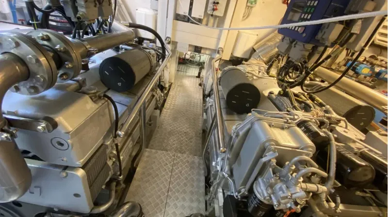  Yacht Photos Pics Engine room of a 2008 Mangusta 72 yacht, showcasing dual engines and mechanical components.