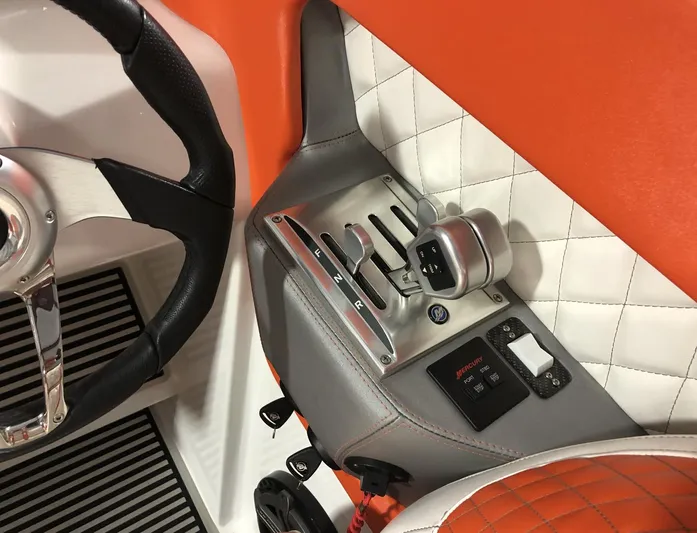  Yacht Photos Pics 2015 Outerlimits SL-50 boat interior, steering wheel, and throttle controls.