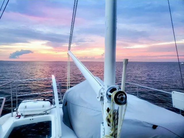 Aquavit Yacht Photos Pics Beneteau Swift Trawler 42, 2006, at sea during a vibrant sunset.