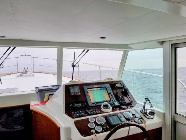 Aquavit Yacht Photos Pics 2006 Beneteau Swift Trawler 42 helm with navigation equipment, overlooking the ocean.