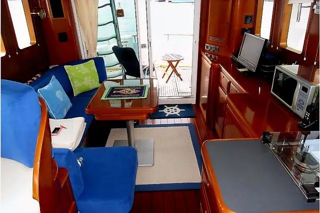 Aquavit Yacht Photos Pics Interior of 2006 Beneteau Swift Trawler 42 with cozy seating and modern amenities.