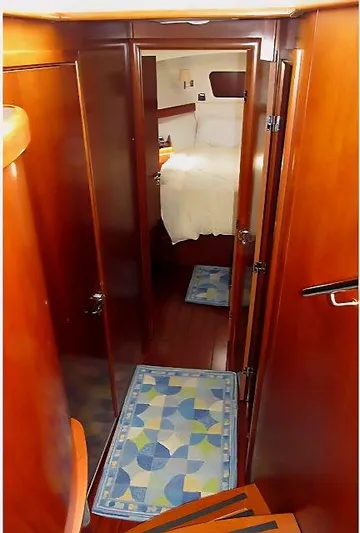 Aquavit Yacht Photos Pics Interior view of 2006 Beneteau Swift Trawler 42, featuring wooden finishes and cozy cabin.