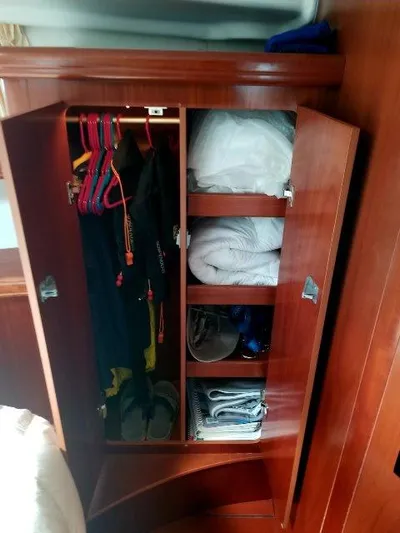Aquavit Yacht Photos Pics Wooden closet in 2006 Beneteau Swift Trawler 42, storing clothes and bedding.