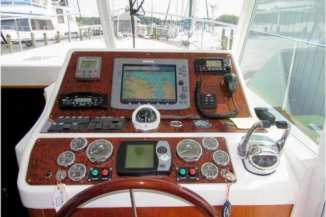 Aquavit Yacht Photos Pics Helm of 2006 Beneteau Swift Trawler 42 with navigation instruments and controls.