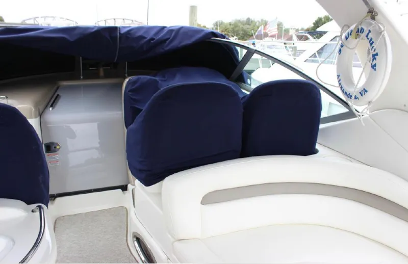  Yacht Photos Pics 2005 Sea Ray 340 Sundancer boat interior with blue seat covers and white upholstery.