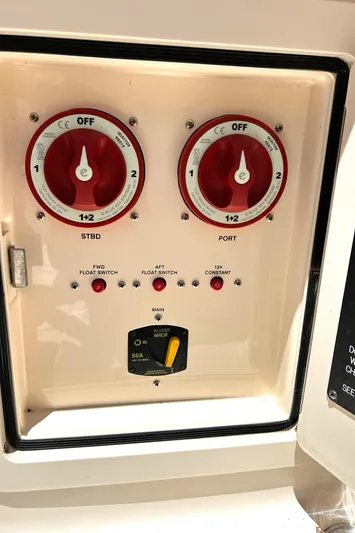  Yacht Photos Pics Control panel of a 2020 Grady-White Freedom 275 boat with switches and dials.