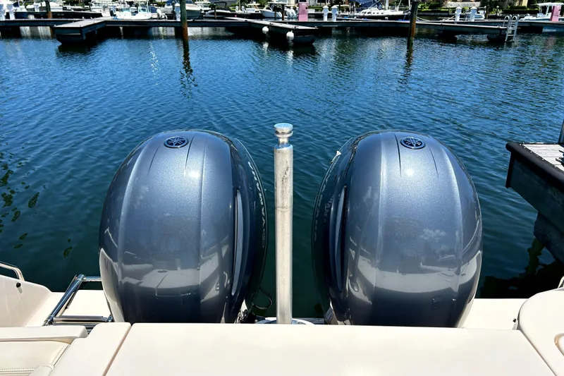  Yacht Photos Pics Twin outboard engines on a 2020 Grady-White Freedom 275 at a marina.