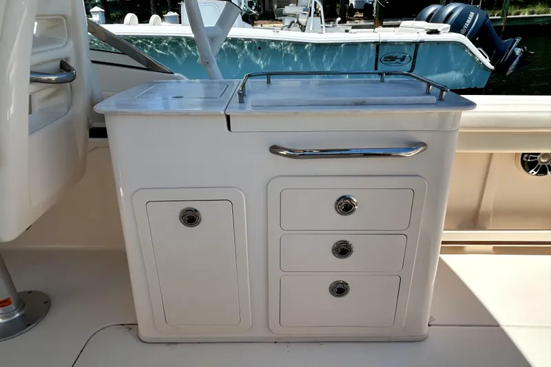  Yacht Photos Pics 2020 Grady-White Freedom 275 boat interior with storage compartments and sleek design.