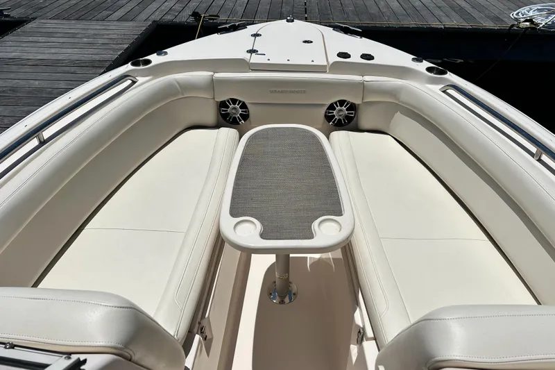  Yacht Photos Pics 2020 Grady-White Freedom 275 boat interior with seating and table.