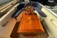 Luxurious Interboat 21 Classic interior with wooden detailing and navy seating, 2000 model.
