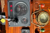 Dashboard of a 2000 Interboat 21 Classic with 2018 motor, featuring gauges and compass.