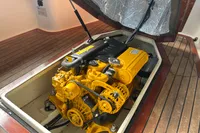 Yellow engine of Interboat 21 Classic, 2018 model, in a wooden boat interior.