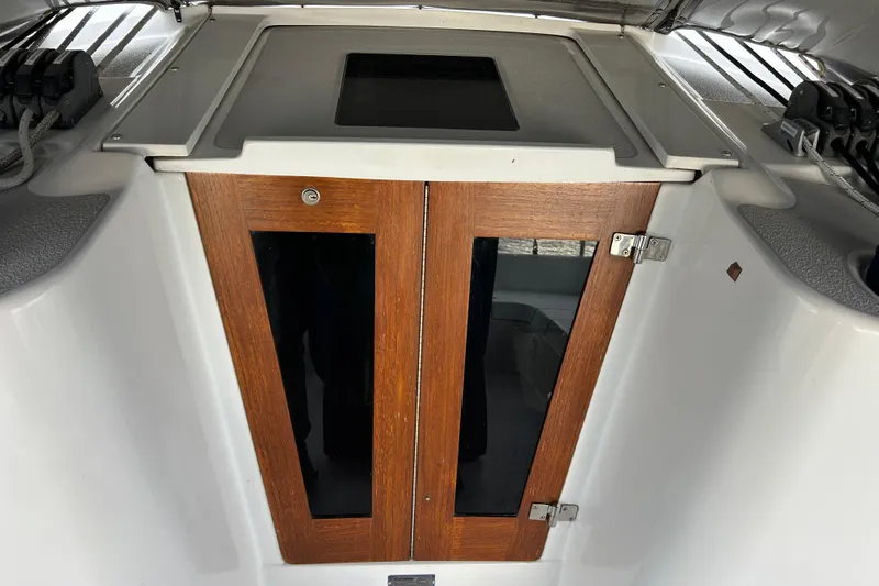  Yacht Photos Pics Wooden cabin doors on a 2009 Catalina 375 sailboat, featuring sleek design and modern hardware.