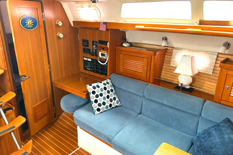  Yacht Photos Pics Interior of 2009 Catalina 375 sailboat with cozy seating and wooden cabinetry.