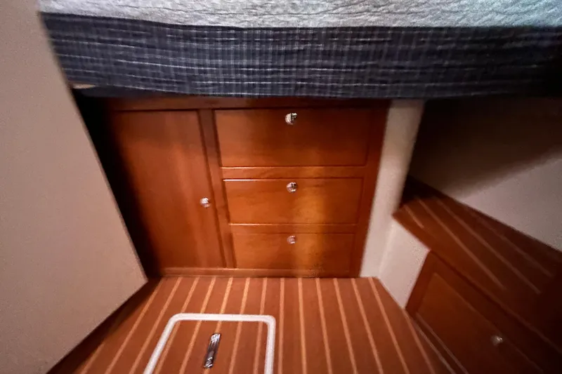  Yacht Photos Pics Wooden cabinetry and flooring inside a 2009 Catalina 375 sailboat cabin.
